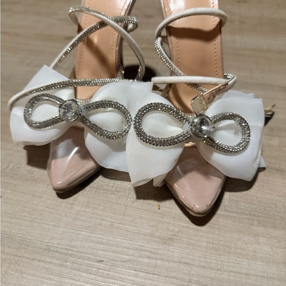 Women's Nude Pointed Toe Heels with White Bow and Rhinestone Accent